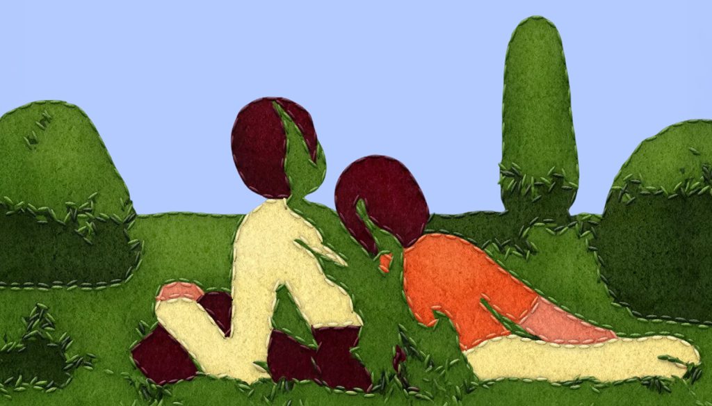 Two people reclining in a field, made from felt and stitches.